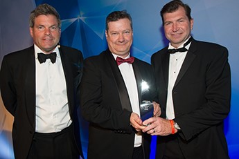 3 Men presenting award